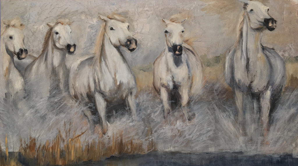 Galloping white horse herd in the Camargue. 
